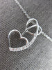 ESTATE .03CT DIAMOND 14KT WHITE GOLD 3D DOUBLE HEART LOVE FLOATING PENDANT