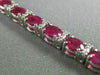ESTATE WIDE 12.22CT DIAMOND & RUBY 18K WHITE GOLD CLASSIC OVAL TENNIS BRACELET