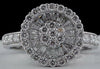 ESTATE 1.11CT DIAMOND 18KT WHITE GOLD ROUND & BAGUETTE CIRCULAR FLOWER LOVE RING