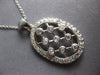 ESTATE .60CT DIAMOND 14KT WHITE GOLD 3D CRISS CROSS ETOILE OVAL FLOATING PENDANT