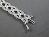 WIDE 4.20CT DIAMOND 14KT WHITE GOLD ROUND CRISS CROSS INFINITY TENNIS BRACELET