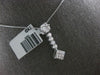 .50CT DIAMOND 14KT WHITE GOLD ROUND & PRINCESS INVISIBLE FLOWER FLOATING PENDANT