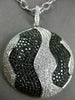 LARGE 4.51CT WHITE & BLACK DIAMOND 18KT WHITE & BLACK GOLD CIRCULAR WAVE PENDANT