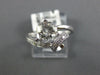 ESTATE 1.33CT DIAMOND & AAA WHITE TOPAZ 14KT WHITE GOLD LOVE KNOT SOLITAIRE RING