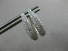 ESTATE .71CT DIAMOND 18KT WHITE GOLD CLASSIC ELONGATED PAVE OVAL HUGGIE EARRINGS