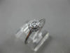 ESTATE .15CT DIAMOND 18KT WHITE GOLD CLASSIC FLOWER HALO BEZEL FRIENDSHIP RING