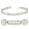 6.65CT DIAMOND 14KT WHITE GOLD ROUND BAGUETTE & PRINCESS FLOWER TENNIS BRACELET