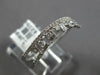 ESTATE .42CT DIAMOND 18KT WHITE GOLD 3D ROUND & BAGUETTE CRISS CROSS FUN RING