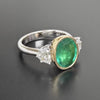 3.69CT DIAMOND & AAA EMERALD 18KT 2 TONE GOLD OVAL BEZEL 3 STONE ENGAGEMENT RING