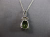 2.29CT DIAMOND & AAA PERDIOT 14KT WHITE GOLD OVAL & ROUND FUN FLOATING PENDANT