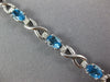 LONG 5.05CT DIAMOND & AAA BLUE TOPAZ 14KT WHITE GOLD OVAL X LOVE TENNIS BRACELET