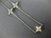 ESTATE .53CT DIAMOND & WHITE ENAMEL 18KT WHITE GOLD FLOWER BY THE YARD NECKLACE