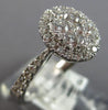 .82CT DIAMOND 18KT WHITE GOLD 3D CLASSIC ROUND CLUSTER HALO OVAL FRIENDSHIP RING