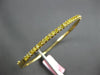1.1CT INTENSE FANCY YELLOW DIAMOND 18KT YELLOW GOLD SHARED PRONG BANGLE BRACELET