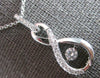 ESTATE .65CT DIAMOND 14KT WHITE GOLD SOLITAIRE DANCING DIAMOND FLOATING PENDANT