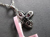 ESTATE .53CT DIAMOND & AAA RUBY 14KT WHITE GOLD MULTI LEAF FLOWER LOVE PENDANT