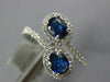 WIDE 1.23CT DIAMOND & AAA SAPPHIRE 18KT WHITE GOLD OVAL & ROUND CRISS CROSS RING