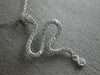 ESTATE .21CT ROUND DIAMOND 14K WHITE GOLD CLASSIC HAPPY SNAKE FLOATING PENDANT