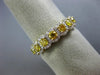 ESTATE .96CT WHITE & FANCY YELLOW DIAMOND 18KT YELLOW GOLD HALO ANNIVERSARY RING