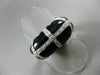 ESTATE WIDE .64CT DIAMOND & ONYX 18KT WHITE & YELLOW GOLD CRISS CROSS FUN RING