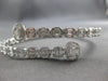 LARGE 5.69CT DIAMOND 18KT WHITE GOLD ROUND & BAGUETTE INVISIBLE BANGLE BRACELET
