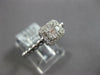 ESTATE .27CT DIAMOND 18KT WHITE GOLD ROUND & BAGUETTE INVISIBLE HALO BEADED RING