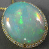 ESTATE EXTRA LARGE 14.04CT DIAMOND & AAA OPAL 14KT YELLOW GOLD OVAL HALO PENDANT