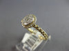 ESTATE .26CT DIAMOND 14KT YELLOW GOLD ROUND CLUSTER INVISIBLE OVAL HALO FUN RING