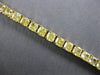 GIA LARGE 20.77CT FANCY YELLOW DIAMOND 18KT YELLOW GOLD CUSHION TENNIS BRACELET