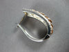WIDE .19CT DIAMOND 14KT WHITE & ROSE GOLD OVAL LOVE KNOT HUGGIE HANGING EARRINGS