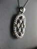 ESTATE .60CT DIAMOND 14KT WHITE GOLD 3D CRISS CROSS ETOILE OVAL FLOATING PENDANT