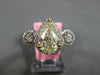 LARGE 2.21CT WHITE & FANCY YELLOW DIAMOND 18KT 2 TONE GOLD HALO ENGAGEMENT RING