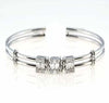 .59CT DIAMOND 18KT WHITE GOLD ROUND & BAGUETTE SQUARE FLOATING BANGLE BRACELET