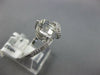 ESTATE 1.33CT DIAMOND & AAA WHITE TOPAZ 14KT WHITE GOLD LOVE KNOT SOLITAIRE RING