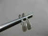 ESTATE .71CT DIAMOND 18KT WHITE GOLD CLASSIC ELONGATED PAVE OVAL HUGGIE EARRINGS