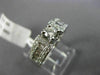 ESTATE .90CT ROUND & BAGUETTE DIAMOND 14KT WHITE GOLD FOUR PRONG ENGAGEMENT RING