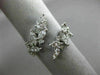 ESTATE WIDE 18KT WHITE GOLD LOVE RING. 3D MULTI LEAF CRISS CROSS DESIGN