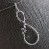 ESTATE LARGE .42CT DIAMOND 14KT WHITE GOLD 3D INFINITY FLOWER FLOATING PENDANT