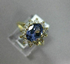 1.83CT DIAMOND & AAA OVAL TANZANITE 14KT YELLOW GOLD FLOWER HALO ENGAGEMENT RING