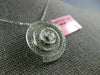 ESTATE .83CT DIAMONDS 18KT WHITE GOLD CIRCULAR MULTI ROW SWIRL SOLITAIRE PENDANT
