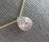 ESTATE .17CT DIAMOND 14KT YELLOW GOLD ROUND & BAGUETTE CLUSTER TEAR DROP PENDANT