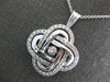 ESTATE LARGE 1.16CT DANCING DIAMOND 14KT WHITE GOLD 3D LOVE KNOT FLOWER PENDANT