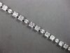 4.22CT DIAMOND 18KT WHITE GOLD ROUND BAGUETTE & MARQUISE SQUARE TENNIS BRACELET