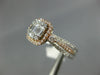 .82CT DIAMOND 14KT WHITE & ROSE GOLD 3D ROUND & BAGUETTE HALO ENGAGEMENT RING