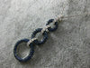 2.16CT DIAMOND & SAPPHIRE 18KT WHITE & BLACK GOLD CIRCULAR JOURNEY LOVE PENDANT