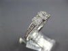 ESTATE .64CT DIAMOND 18KT WHITE GOLD ROUND & BAGUETTE INVISIBLE SQUARE LOVE RING