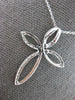 ESTATE 1.02CT DIAMOND 14KT WHITE GOLD MULTI LEAF INFINITY CROSS FLOATING PENDANT