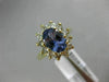 1.83CT DIAMOND & AAA OVAL TANZANITE 14KT YELLOW GOLD FLOWER HALO ENGAGEMENT RING
