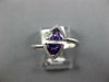 .70CT DIAMOND & AAA AMETHYST 14KT WHITE GOLD TRILLION & ROUND CRISS CROSS RING