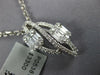 .73CT DIAMOND 18KT WHITE GOLD ROUND & BAGUETTE DOUBLE LEAF INFINITY LOVE PENDANT